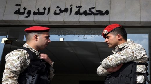 Jordanian security forces stand guard outside a military court as members of a cell accused of involvement in a shooting attack in 2016 go on trial at the military State Security Court in the Jordanian capital of Amman on November 13, 2018. - The Jordanian court today sentenced 10 people to prison terms of between three years and life in connection with the deadly December 2016 attack claimed by the Islamic State (IS) group. The shooting attack in Karak, site of one of the region's largest Crusader castles, killed seven policemen and two Jordanian civilians as well as a female Canadian tourist, and wounded 34 other people. (Photo by Khalil MAZRAAWI / AFP) (Photo credit should read KHALIL MAZRAAWI/AFP/Getty Images)