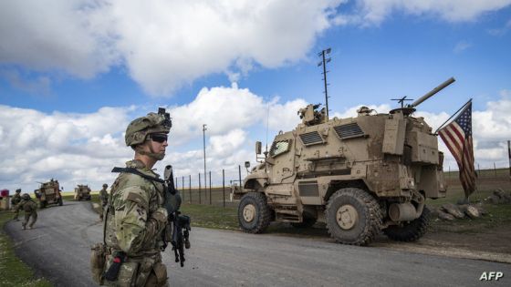 US soldiers patrol the town of al-Qahtaniyah in Syria's northeastern Hasakeh province near the Turkish border on March 14, 2022, a day after the Iranian military claimed responsibility for missile strikes on Iraq's northern Kurditsan region. (Photo by Delil souleiman / AFP) / The erroneous mention appearing in the metadata of this photo by Delil souleiman has been modified in AFP systems in the following manner: [ON IRAQ'S NORTHERN KURDISTAN REGION] instead of [ON ITS NORTHERN]. Please immediately remove the erroneous mention[s] from all your online services and delete it (them) from your servers. If you have been authorized by AFP to distribute it (them) to third parties, please ensure that the same actions are carried out by them. Failure to promptly comply with these instructions will entail liability on your part for any continued or post notification usage. Therefore we thank you very much for all your attention and prompt action. We are sorry for the inconvenience this notification may cause and remain at your disposal for any further information you may require.