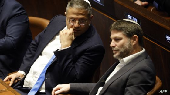 Right-wing Knesset members Itamar Ben-Gvir (L) and Bezalel Smotrich, attend a special session at the Knesset Israel's parliament, to approve and swear in a new right-wing government, in Jerusalem on December 29, 2022. The right-wing government, formed after the fifth election in four years, has sparked fears of a further military escalation in the Israeli-occupied West Bank, amid the worst violence there for nearly 20 years. (Photo by AMIR COHEN / POOL / AFP)