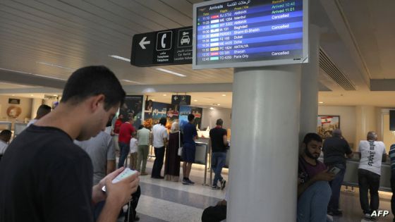 Passengers check their flight times at the Beirut International Airport in Beirut on August 25, 2024, amid escalations in the ongoing cross-border tensions between Hezbollah and Israel. The Beirut airport did not close but some airlines, including Royal Jordanian and Etihad Airways, cancelled flights. (Photo by ANWAR AMRO / AFP)