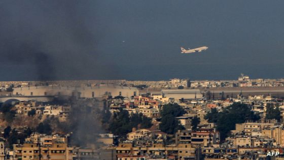 A Middle East Airlines commercial aircraft taking off from Beirut's international airport, flies amid smoke billowing above the Lebanese capital's southern suburbs, in the aftermath of overnight Israeli airstrikes, on September 28,2024. Thousands of residents in Beirut's densely-packed southern suburbs camped out overnight in streets, public squares and makeshift shelters after Israel ordered them out before its jets attacked the Hezbollah stronghold. (Photo by AFP)