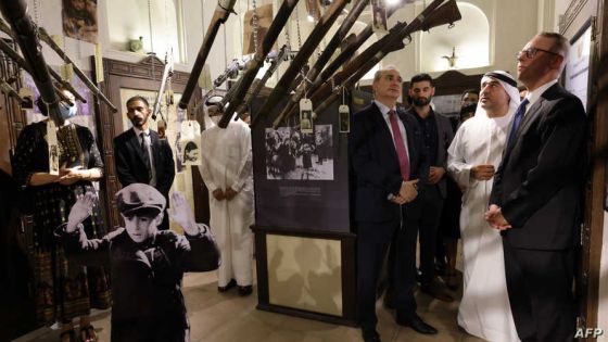 Israeli's Ambassador to the United Arab Emirates (UAE) Eitan Na'eh (L) Ahmed Al Mansuri, founder of Crossroads of Civilization private museum (2-R) and German Amabassado to the UAE Peter Fischer (R) visit an exibition commemorating the Jewish Holocaust on May 26, 2021, at the Museum in the Gulf Emirate of Dubai. (Photo by GIUSEPPE CACACE / AFP)