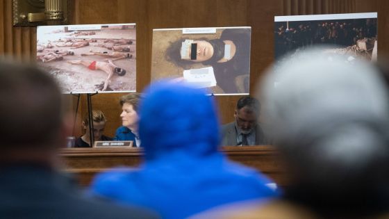 A Syrian military defector using the pseudonym Caesar, while also wearing a hood to protect his identity, testifies about the war in Syria during a Senate Foreign Relations committee hearing on Capitol Hill in Washington, DC, March 11, 2020. (Photo by SAUL LOEB / AFP)