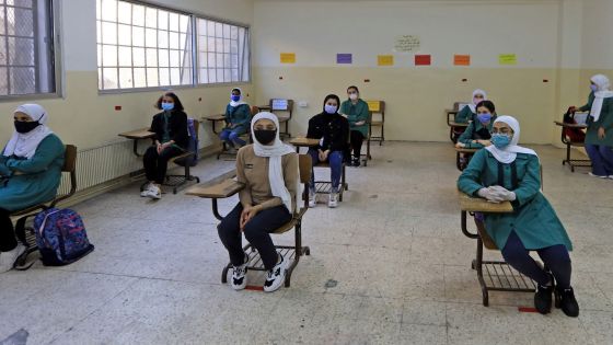 Students, wearing protective masks, sit in a classroom on the first day of school in the Jordanian capital Amman amid the ongoing COVID-19 pandemic, on September 1, 2020. (Photo by Khalil MAZRAAWI / AFP) (Photo by KHALIL MAZRAAWI/AFP via Getty Images)