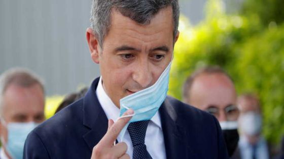 French Interior Minister Gerald Darmanin removes his protective face mask before a news conference after an assailant stabbed and badly wounded a policewoman in La Chapelle-sur-Erdre, western France, May 28, 2021. REUTERS/Stephane Mahe