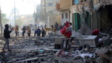 A young boy tries to salvage some objects amid the rubble of a building hit by an Israeli strike in Khan Yunis in the southern Gaza Strip on December 9, 2023. - Israel pressed its offensive against Hamas militants in Gaza on December 9, after the United States blocked an extraordinary UN bid to call for a ceasefire in the two-month war. (Photo by AFP)