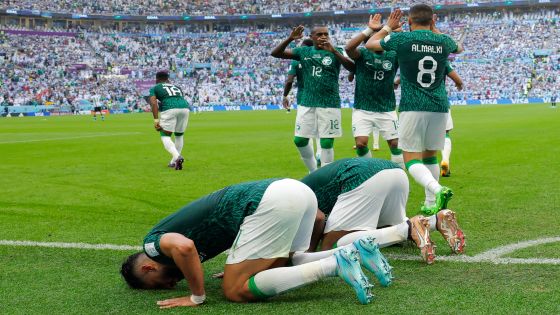 Saudi Arabia's forward #11 Saleh Al-Shehri (L) celebrates after scoring his team's first goal during the Qatar 2022 World Cup Group C football match between Argentina and Saudi Arabia at the Lusail Stadium in Lusail, north of Doha on November 22, 2022. (Photo by Odd ANDERSEN / AFP)