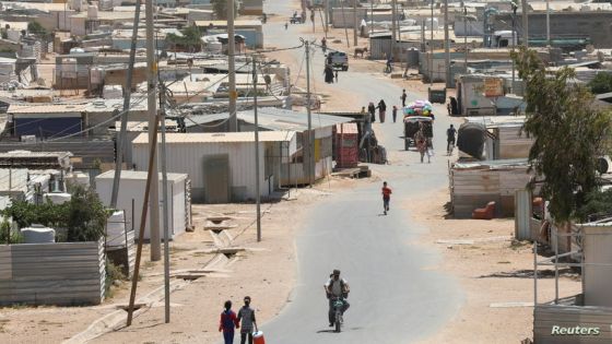 Syrian refugees walk at the Zaatari refugee camp in the Jordanian city of Mafraq, near the border with Syria, Jordan June 17, 2021. Picture taken June 17, 2021. REUTERS/Alaa Al Sukhni