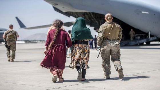 A Marine with the 24th Marine Expeditionary Unit walks with the children during an evacuation at Hamid Karzai International Airport in Kabul, Afghanistan, August 24, 2021. Sgt. Samuel Ruiz/U.S. Marine Corps/Handout via REUTERS THIS IMAGE HAS BEEN SUPPLIED BY A THIRD PARTY.