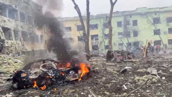 A car burns after the destruction of Mariupol children's hospital as Russia's invasion of Ukraine continues, in Mariupol, Ukraine, March 9, 2022 in this still image from a handout video obtained by Reuters. Ukraine Military/Handout via REUTERS THIS IMAGE HAS BEEN SUPPLIED BY A THIRD PARTY.