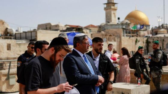 Israel's National Security Minister Itamar Ben-Gvir looks on, while Jewish worshippers cover themselves in their prayer shawls, as they pray during a priestly blessing on the Jewish holiday of Passover, at the Western Wall, Judaism's holiest prayer site, followed by a special pray for the hostages held in Gaza, the well-being of the Israeli soldiers, the Jewish nation and for healing of the injured, in Jerusalem's Old City, April 25, 2024. REUTERS/Ammar Awad