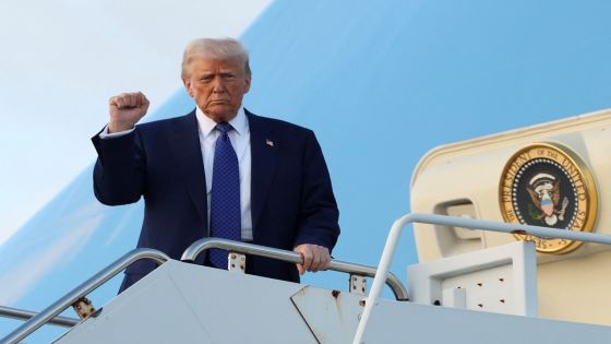 U.S. President Donald Trump raises his fist upon arrival in West Palm Beach, Florida, U.S., February 14, 2025. REUTERS/Kevin Lamarque