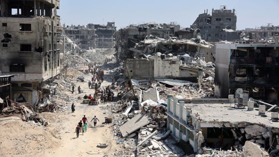 Palestinians carry some salvaged belongings as they leave the Jabalia refugee camp in the northern Gaza Strip after they returned briefly to check on their homes on May 31, 2024, amid the ongoing conflict between Israel and the militant group Hamas. (Photo by Omar AL-QATTAA / AFP) (Photo by OMAR AL-QATTAA/AFP via Getty Images)