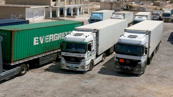 Long-haul trucks are parked by the closed Jaber/Nassib border post at Jordan's border with Syria, on August 1, 2021. Jordan announced a day earlier the decision to close the Jaber/Nassib border post with Syria "temporarily" as a result of security developments in the southern province of Daraa after the deadliest flareup in three years killed 28 people. (Photo by Khalil MAZRAAWI / AFP)