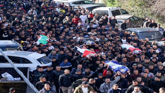 Palestinians carry the bodies of four of the 9 reported victims killed during an Israeli raid on the West Bank's Jenin refugee camp, during their funeral procession in the city of the same name, on January 26, 2023. - An Israeli raid on Jenin refugee camp today killed 9 Palestinians including an elderly woman, Palestinian officials said, also accusing the army of using tear gas inside a hospital.Israel's army declined to comment when asked by AFP about the health minister's tear gas allegation. (Photo by JAAFAR ASHTIYEH / AFP)