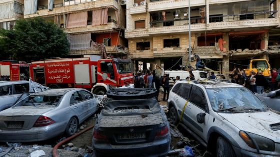 People gather near a firetruck and damaged vehicles at the site of Friday's Israeli strike, as search and rescue operations continue, in Beirut's southern suburbs, Lebanon September 21, 2024. REUTERS/Amr Abdallah Dalsh