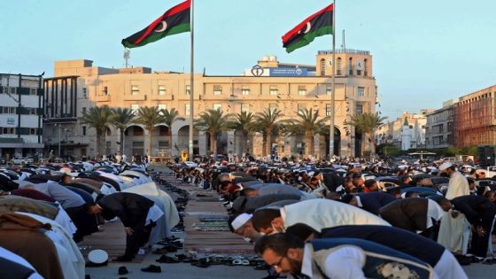 Muslim devotees pray on the first day of Eid al-Fitr, which marks the end of the holy fasting month of Ramadan, at the Martyrs' Square of Libya's capital Tripoli on May 2, 2022. (Photo by Mahmud Turkia / AFP)