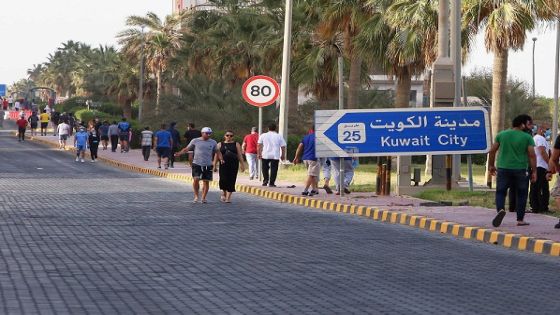 Residents walk in a neighbourhood of Kuwait City on May 12, 2020, as authorities allowed people to exercise for two hours under a nationwide lockdown due to the COVID-19 pandemic. (Photo by YASSER AL-ZAYYAT / AFP)