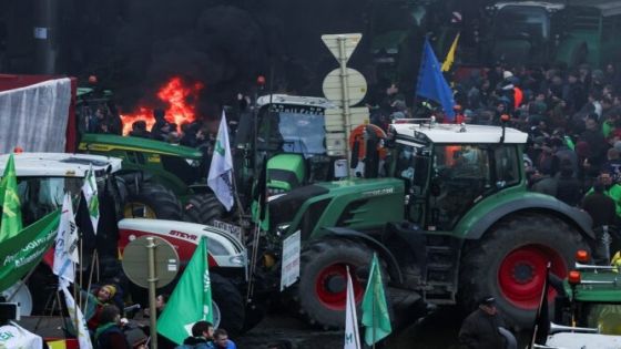 People gather as Belgian farmers use their tractors to block the European Union headquarters, as they protest over price pressures, taxes and green regulation, grievances shared by farmers across Europe, in Brussels, Belgium February 1, 2024. REUTERS/Yves Herman