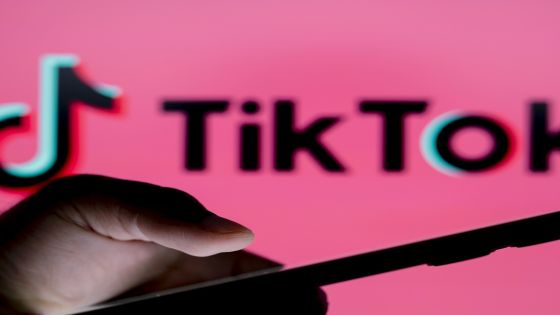 PARAGUAY - 2024/07/10: In this photo illustration, the TikTok logo seen in the background of a silhouette person holding a smartphone. (Photo Illustration by Jaque Silva/SOPA Images/LightRocket via Getty Images)