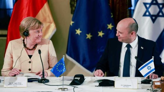 German Chancellor Angela Merkel reacts as she attends a cabinet meeting with Israeli Prime Minister Naftali Benett in Jerusalem, October 10, 2021. Menahem Kahana/Pool via REUTERS