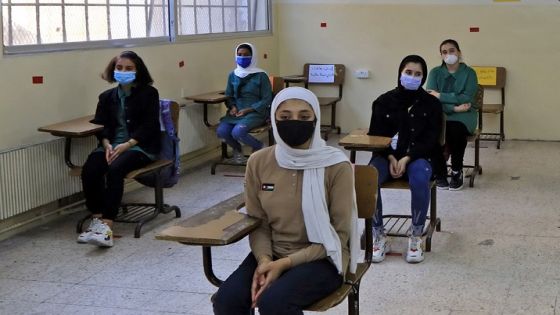 Students, wearing protective masks, sit in a classroom on the first day of school in the Jordanian capital Amman amid the ongoing COVID-19 pandemic, on September 1, 2020. (Photo by Khalil MAZRAAWI / AFP) (Photo by KHALIL MAZRAAWI/AFP via Getty Images)