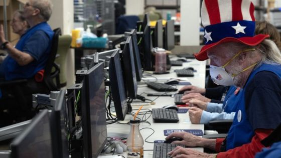 Bob George, a signature verifier election judge, wears an American flag themed top hat, while working at the Denver Elections Division during the presidential primary in Denver, Colorado on Super Tuesday, March 5, 2024. - Americans from 15 states and one territory vote simultaneously on "Super Tuesday," a campaign calendar milestone expected to leave Donald Trump a hair's breadth from securing the Republican Party's presidential nomination. (Photo by Jason Connolly / AFP)