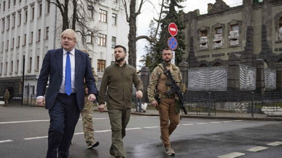 In this image provided by the Ukrainian Presidential Press Office, Ukrainian President Volodymyr Zelenskyy, center, and Britain's Prime Minister Boris Johnson, center left, walk during their meeting in downtown Kyiv, Ukraine, Saturday, April 9, 2022. (Ukrainian Presidential Press Office via AP)