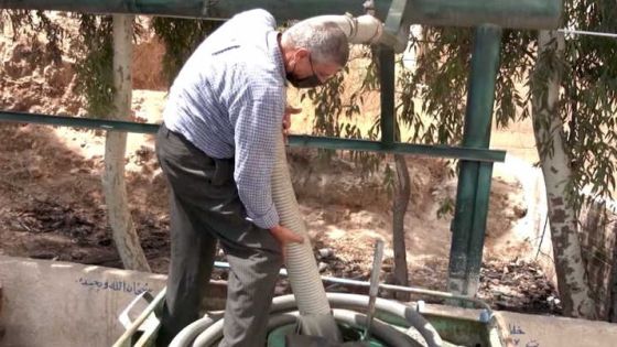 A screen grab shows a man filling a water tank with water, in Amman, Jordan August 31, 2021. Video taken August 31, 2021. REUTERS TV/via REUTERS