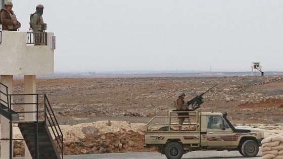 A picture taken during a tour origanized by the Jordanian Army shows soldiers patrolling along the border with Syria to prevent trafficking, on February 17, 2022. - Drug trafficking from Syria into Jordan is becoming "organised" with smugglers stepping up operations and using sophisticated equipment including drones, Jordan's army said, warning of a shoot-to-kill policy. Since the beginning of this year, Jordan's army has killed 30 smugglers and foiled attempts to smuggle into the kingdom from Syria 16 million Captagon pills -- more than they seized in the whole of 2021 -- the military said. (Photo by Khalil MAZRAAWI / AFP)