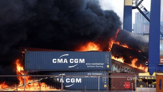 Smoke rises from burning containers at the port in the earthquake-stricken town of Iskenderun, Turkey, February 7, 2023. REUTERS/Benoit Tessier