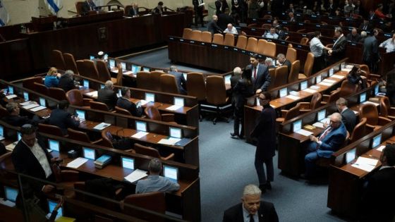 Israel's lawmaker Yair Lapid, walks in the Israel's parliament, the Knesset, as lawmakers convene for a vote on a contentious plan to overhaul the country's legal system, in Jerusalem, February 20, 2023. Maya Alleruzzo/Pool via REUTERS