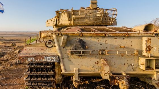 Israeli flag flying beside a decommissioned Israeli Centurion tank used during the Yom Kippur War at Tel Saki on the Golan Heights in Israel