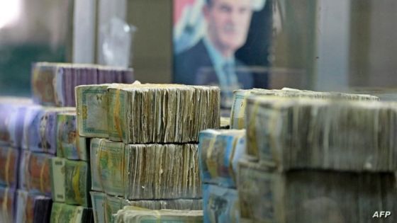 This picture shows stacks of Syrian lira banknotes at the Commercial Bank of Syria in Damascus, on November 10, 2022. (Photo by LOUAI BESHARA / AFP)