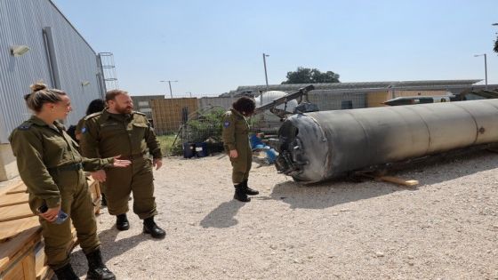 Members of the Israeli military stand next to an Iranian ballistic missile which fell in Israel on the weekend, during a media tour at the Julis military base near the southern Israeli city of Kiryat Malachi on April 16, 2024. Iran carried out an unprecedented direct attack on Israel overnight April 13-14, using more than 300 drones, cruise missiles and ballistic missiles, in retaliation for a deadly April 1 air strike on the Iranian consulate in Damascus. Nearly all were intercepted, according to the Israeli military. (Photo by GIL COHEN-MAGEN / AFP)