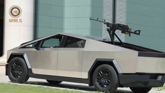 In this image from video posted by Chechen leader Ramzan Kadyrov's Telegram channel on Saturday, Aug. 17, 2024, Kadyrov drives a Tesla Cybertruck equipped with a machine gun in Grozny, Chechnya. (Ramzan Kadyrov Telegram channel via AP)