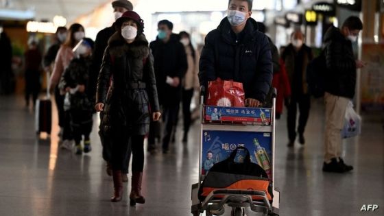 Passengers walk through a departure terminal of the international airport in Beijing on December 29, 2022. - China announced this week that incoming travellers would no longer have to quarantine from January 8, the latest major reversal of strict restrictions that have kept the country largely closed off to the world since the start of the pandemic. (Photo by Noel Celis / AFP)