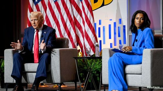 Republican presidential nominee and former U.S. President Donald Trump speaks on a panel of the National Association of Black Journalists (NABJ) convention as Rachel Scott, senior congressional correspondent for ABC News, looks away, in Chicago, Illinois, U.S. July 31, 2024. REUTERS/Vincent Alban