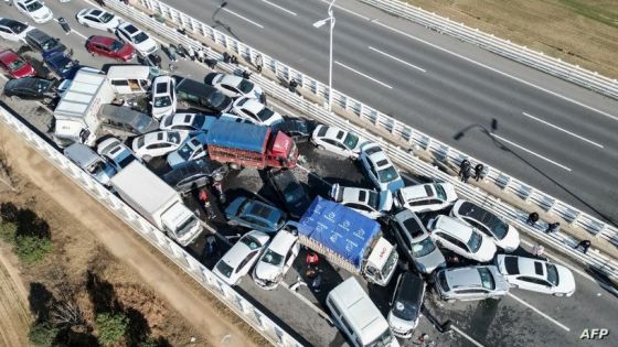 This aerial photo taken on December 28, 2022 shows a multi-vehicle collision on Zhengxin Yellow River Bridge in Zhengzhou, in China's central Henan province. (Photo by AFP) / China OUT