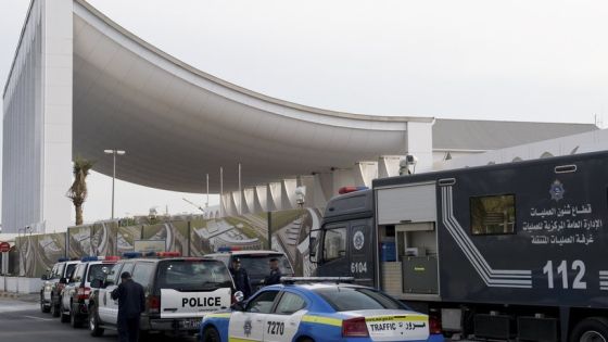 Police vehicles are parked in front of the Kuwait Parliament after cordoning off all foot and vehicle access within the perimeter of the area December 10, 2009, to prevent congregations of "stateless" Kuwaiti residents known as "bedoons". The Kuwaiti Parliament did not discuss the issue on "bedoons" as scheduled due to the lack of quorum. REUTERS/Stephanie McGehee (KUWAIT POLITICS)