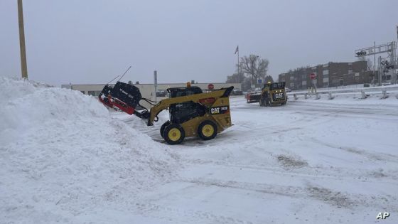 A Snowplow clears a parking lot in Pierre, S.D. on Wednesday, Feb. 22, 2023. Brutal winter weather hammered the northern U.S. Wednesday with “whiteout” snow, dangerous wind gusts and bitter cold, shutting down roadways, closing schools and businesses and prompting dire warnings for people to stay home. (AP Photo/Amancai Biraben)