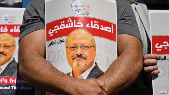 Friends of murdered Saudi journalist Jamal Khashoggi hold posters bearing his picture as they attend an event marking the second-year anniversary of his assassination in front of Saudi Arabia Istanbul Consulate, on October 2, 2020. - Khashoggi, a Washington Post columnist, was killed and dismembered at the Saudi consulate in Istanbul on October 2, 2018, in an operation that reportedly involved 15 agents sent from Riyadh. His remains have not been found. (Photo by Ozan KOSE / AFP)