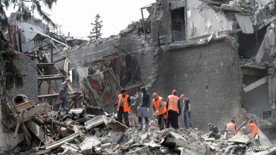 FILE PHOTO: Emergency management specialists and volunteers remove the debris of a theatre building destroyed in the course of Ukraine-Russia conflict in the southern port city of Mariupol, Ukraine April 25, 2022. REUTERS/Alexander Ermochenko/File Photo