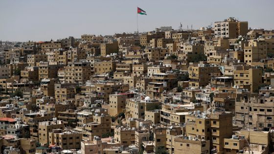 TOPSHOT - A big Jordanian flag flutters in front of Amman's Jabal al-Qala district on June 8, 2018. - Jordan's authorities may have shelved a proposed income tax hike after a week of protests -- but they still face the tricky task of balancing popular demands with the need to fix the economy. The controversial legislation sparked some of the biggest economic demonstrations to hit the country in the past five years, forcing a change of prime minister, with Hani Mulki stepping down in favour of Harvard-trained economist Omar al-Razzaz. (Photo by AHMAD GHARABLI / AFP) (Photo credit should read AHMAD GHARABLI/AFP/Getty Images)