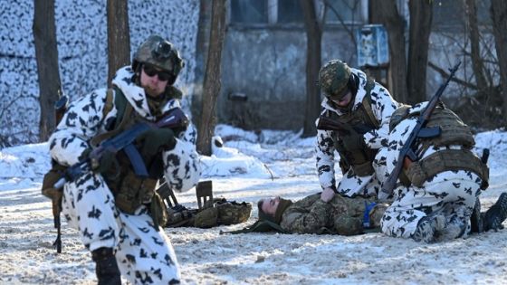 Servicemen take part in a joint tactical and special exercises of the Ukrainian Ministry of Internal Affairs, the Ukrainian National Guard and Ministry Emergency in a ghost city of Pripyat, near Chernobyl Nuclear Power Plant on February 4, 2022. (Photo by Sergei Supinsky / AFP) (Photo by SERGEI SUPINSKY/AFP via Getty Images)