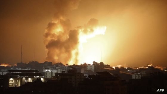 Fire and smoke rises above buildings during an Israeli air strike in Gaza City on October 8, 2023. At least 200 Israelis died in a surprise large-scale attack by the Palestinian militant group Hamas on October 7, 2023, the army said, as Prime Minister Benjamin Netanyahu vowed to reduce the group's Gaza hideouts to "rubble". (Photo by EYAD BABA / AFP)