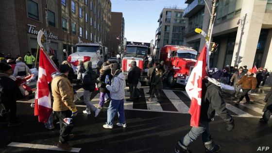 Demonstrators gather for a protest against mandates related to Covid-19 vaccines and restrictions in downtown Toronto, Ontario, Canada, on February 5, 2022. - Protesters again poured into Toronto and Ottawa early on February 5 to join a convoy of truckers whose occupation of Ottawa to denounce Covid vaccine mandates is now in its second week. (Photo by Geoff Robins / AFP)