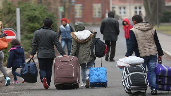 BERLIN, GERMANY - MARCH 11: People pulling suitcases arrive at the Central Registration Office for Asylum Seekers (Zentrale Aufnahmestelle fuer Fluechtlinge, or ZAA) of the State Office for Health and Social Services (Landesamt fuer Gesundheit und Soziales, or LAGeSo), which is the registration office for refugees and migrants arriving in Berlin who are seeking asylum in Germany, on March 11, 2015 in Berlin, Germany. Germany, which registered over 200,000 refugees in 2014, is expecting even more in 2015 and many cities and towns are reeling under the burden of having to accommodate them. The main countries of origin of the refugees include Syria, Serbia, Eritrea, Afghanistan, Iraq, Kosovo and Albania. (Photo by Sean Gallup/Getty Images)