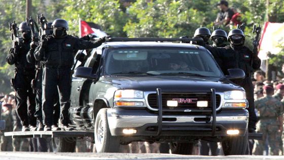 Amman, JORDAN: Members of an anti-terrorist squad participate in the first military parade since King Abdullah II ascended the throne seven years ago, during celebrations to mark the 85th anniversary of Jordan's armed forces, 10 June 2006 in Amman. The Jordanian army has grown from 750 men in 1923 to a combined force of more than 100,000 troops ever since conscription was suspended in 1999, in the aftermath of the 1994 peace treaty with Israel. PHOTO/KHALIL MAZRAAWI (Photo credit should read KHALIL MAZRAAWI/AFP via Getty Images)