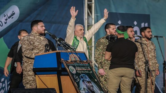 24 May 2021, Palestinian Territories, Gaza City: Yahya Sinwar, leader of the Palestinian Hamas Islamist movement in the Gaza Strip, stands on the stage during a rally by Hamas military wing 'Izz ad-Din al-Qassam Brigades' to commemorate the martyrs of the last battle between Hamas and Israel. Photo: Mohammed Talatene/dpa (Photo by Mohammed Talatene/picture alliance via Getty Images)